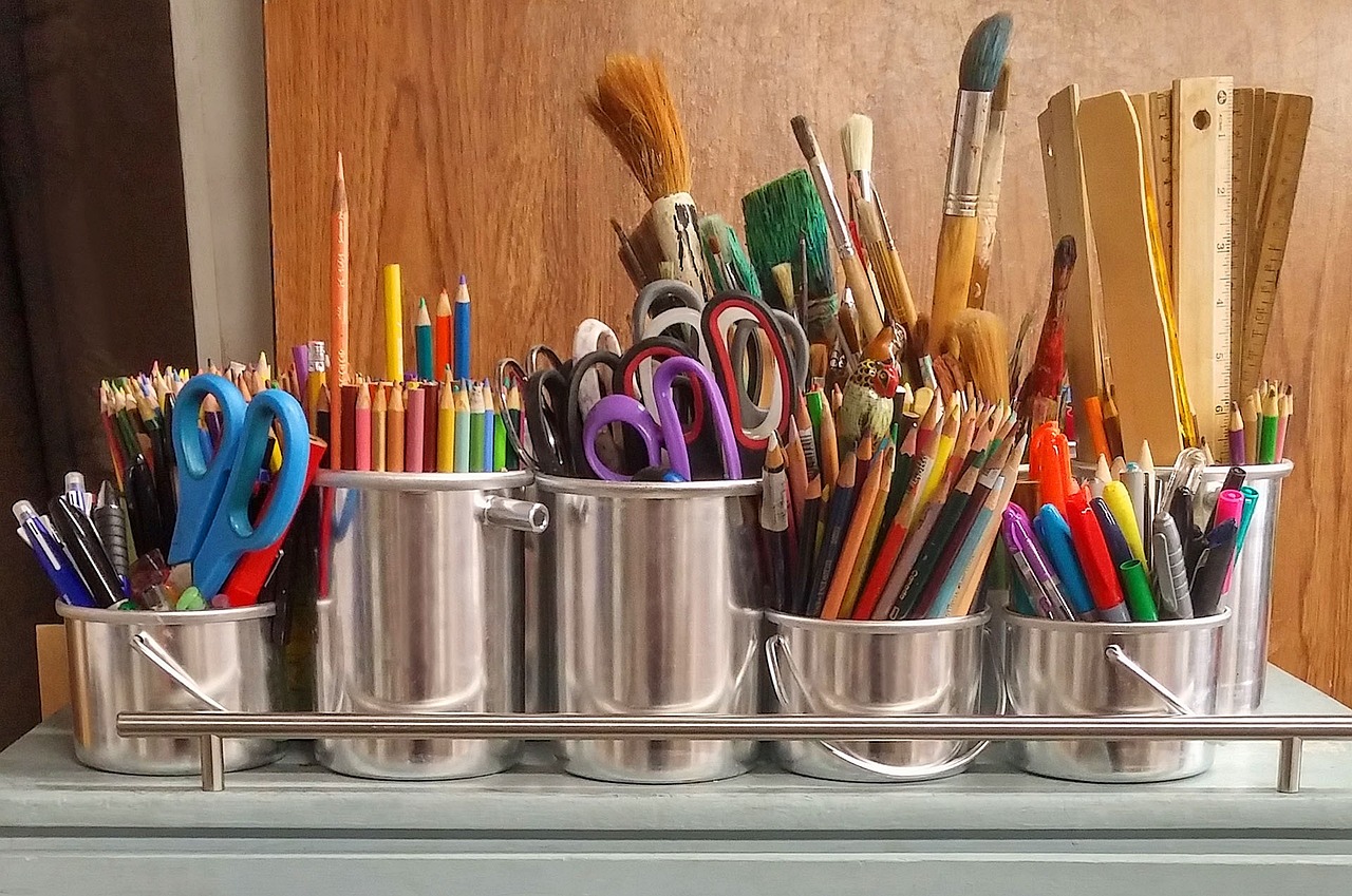 Art supplies in silver cups